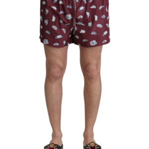 Step up your beachwear game with these absolutely stunning Maroon Elegance Men’s Swimming Trunks. Crafted by the renowned Dolce & Gabbana