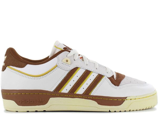 100% Original Adidas !  Herstellerfarbe:  Chalk White / Wild Brown / Hazy Yellow   Obermaterial:  Leder / Textil   Zustand:  Neu  und  Originalverpackt         Dieser adidas Schuh ist die perfekte Mischung aus retro und modern. In den 80ern war der Rivalry auf dem Basketballplatz und in der Sneakerszene einfach nicht zu toppen. Heute ist er ein gefeierter Streetwear-Sneaker mit Kultstatus. Er kommt mit einem Colourway im College-Style und einem cleanen Obermaterial aus Leder. Ein EVA-Einsatz dämpft außerdem jeden deiner Schritte..      Obermaterial aus besten Leder mit adidas Streifen aus Textil.  Sneaker mit B-Ball-DNA.  Schnürung für individuellen Style und optimalen Sitz.  Komfortable Polsterung am Bund und Zunge.  Griffige Laufsohle aus Gummi.  EVA-Einsatz.  Innenfutter Textil.